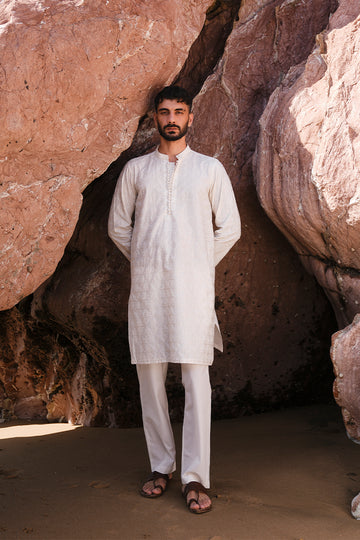 Elegant Ivory White Embroidered Kurta Pajama for men with intricate design.